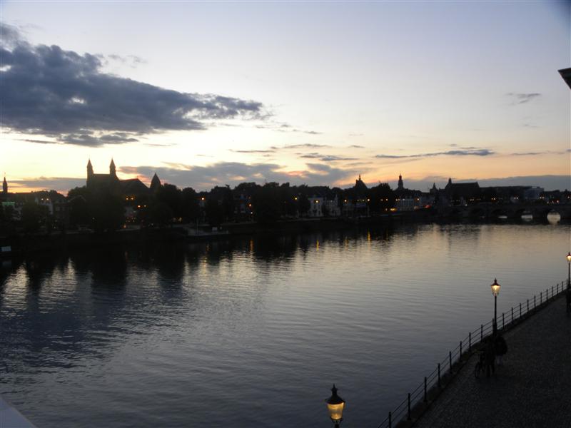 Riding over the Maas (on my bike!) at sunset 
